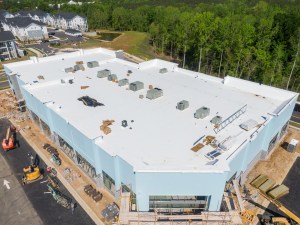 drone,images,of,tpo,commercial,roof,with,some,metal,panels